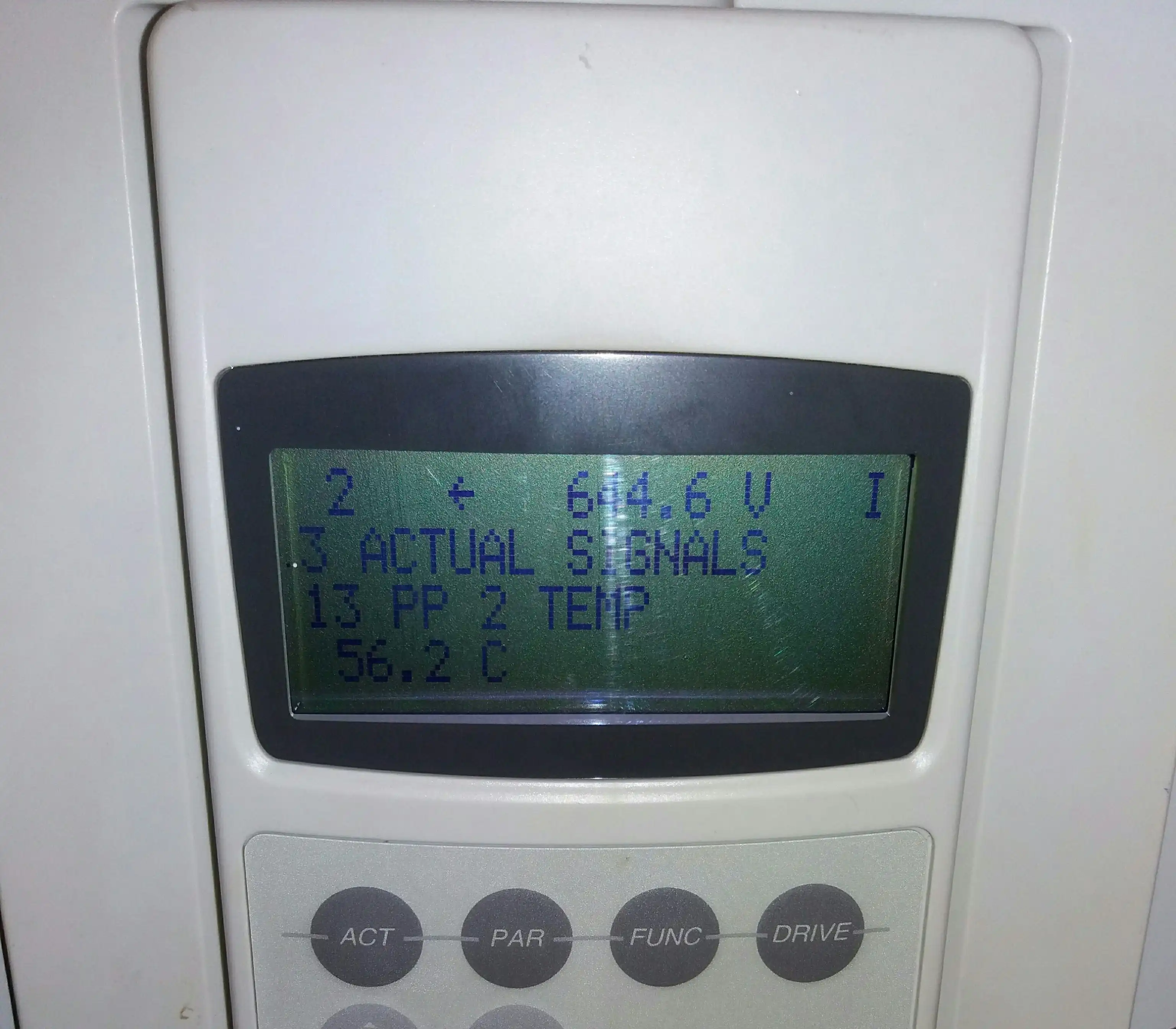 Central solar inverter display showing Actual Signals parameter PP 2 TEMP reading 56.2 degrees Celsius, taken during normal operation with the cooling system functioning