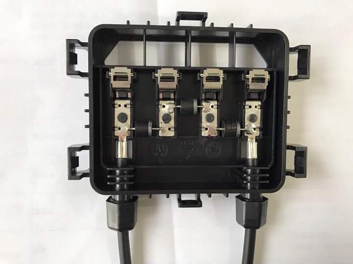 Open solar module junction box showing three bypass diodes protecting three cell substrings