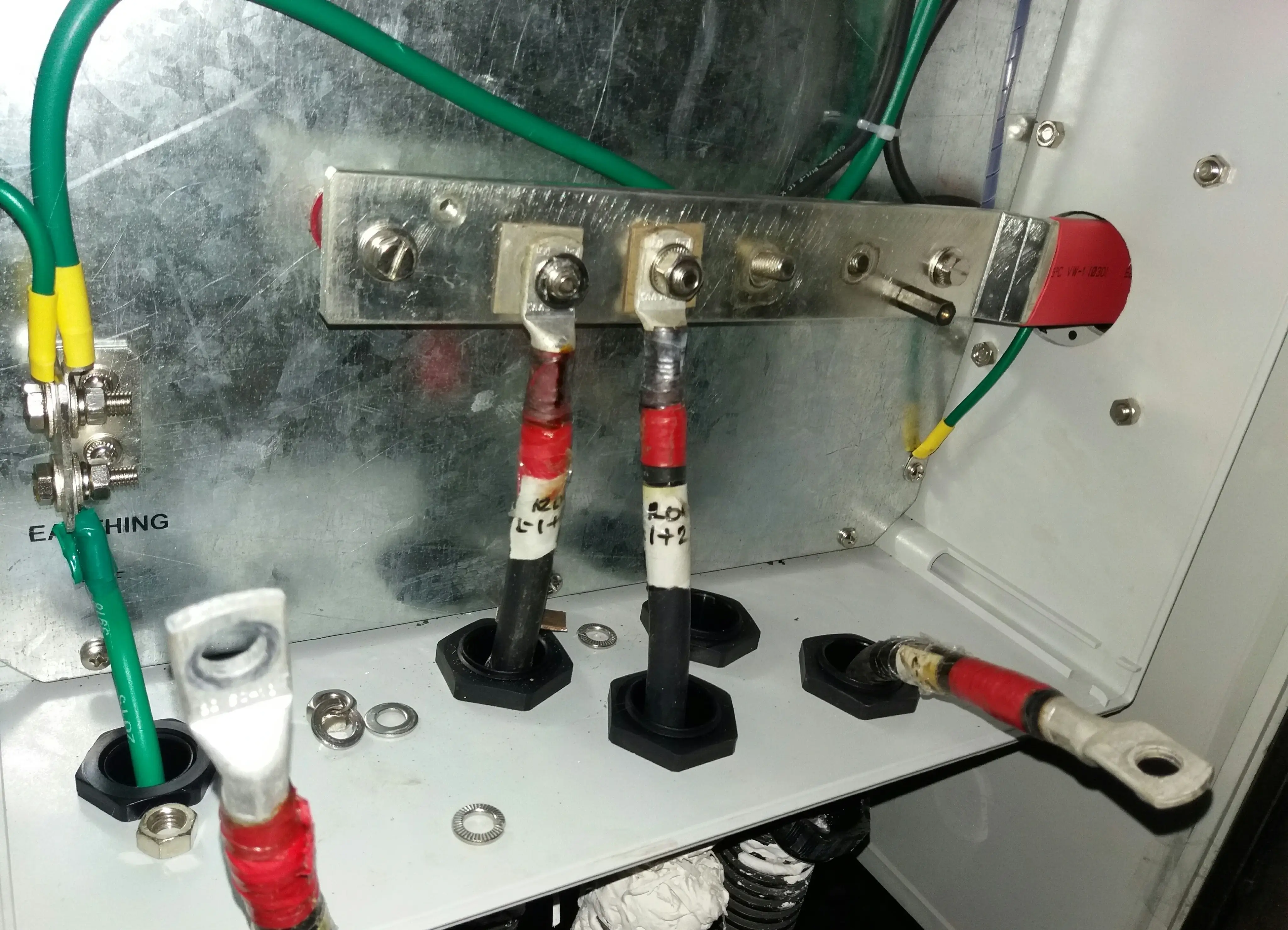 PV string connectors and DC cable terminations inside a solar combiner box